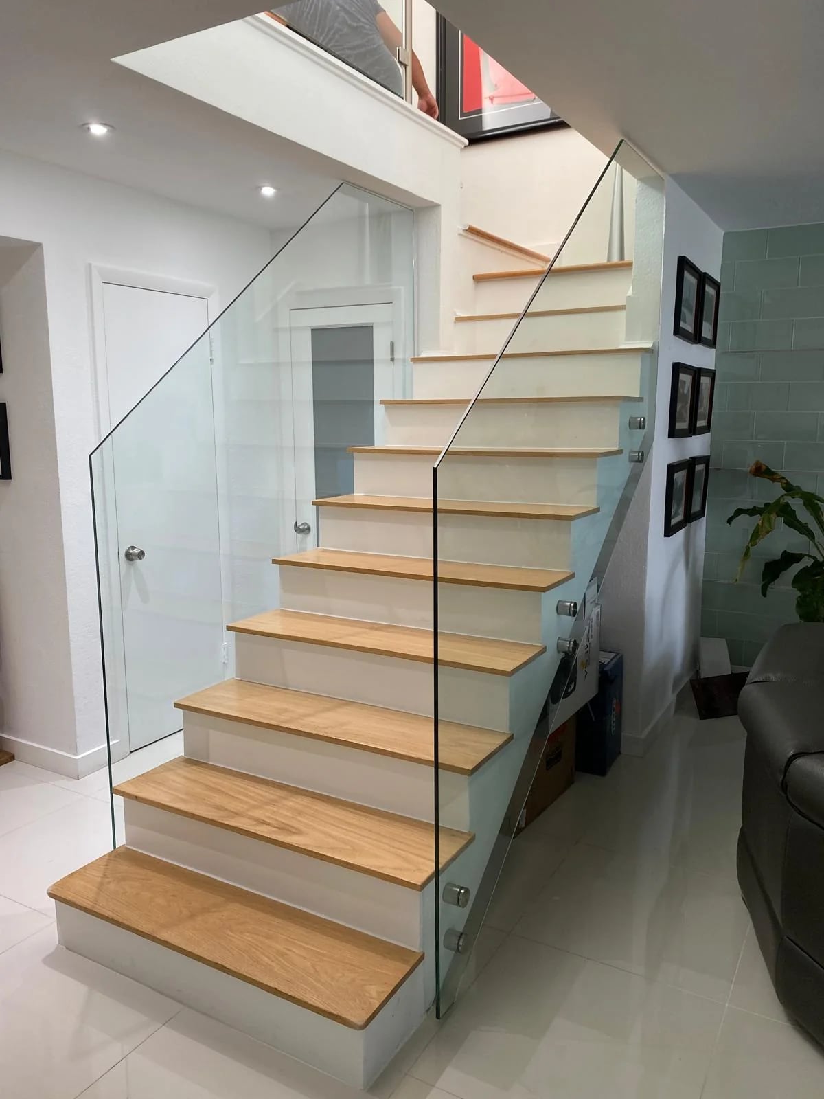 Glass stair panels with metal clamps Fort Lauderdale
