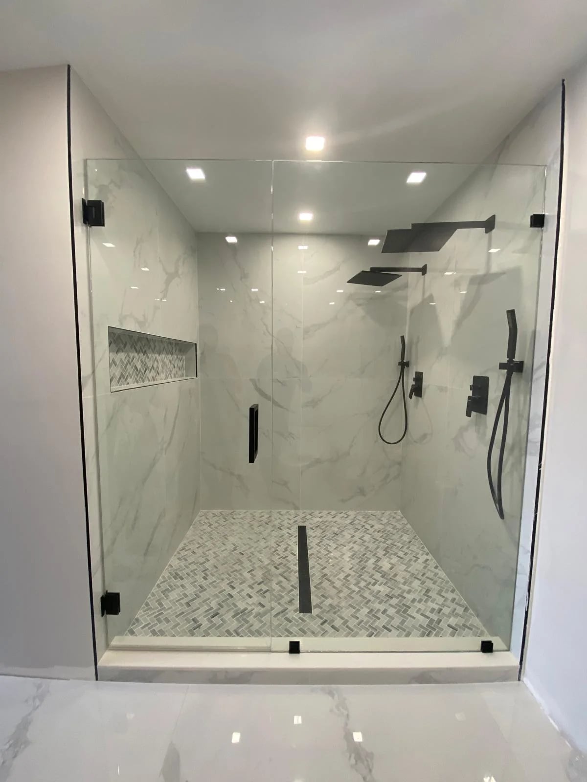 Custom shower door with brushed nickel hardware Miami
